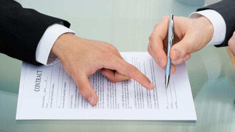 40870633 - person pointing on paper to sign on contract